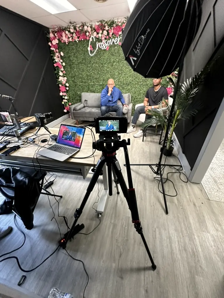 Two-camera interview on a client set